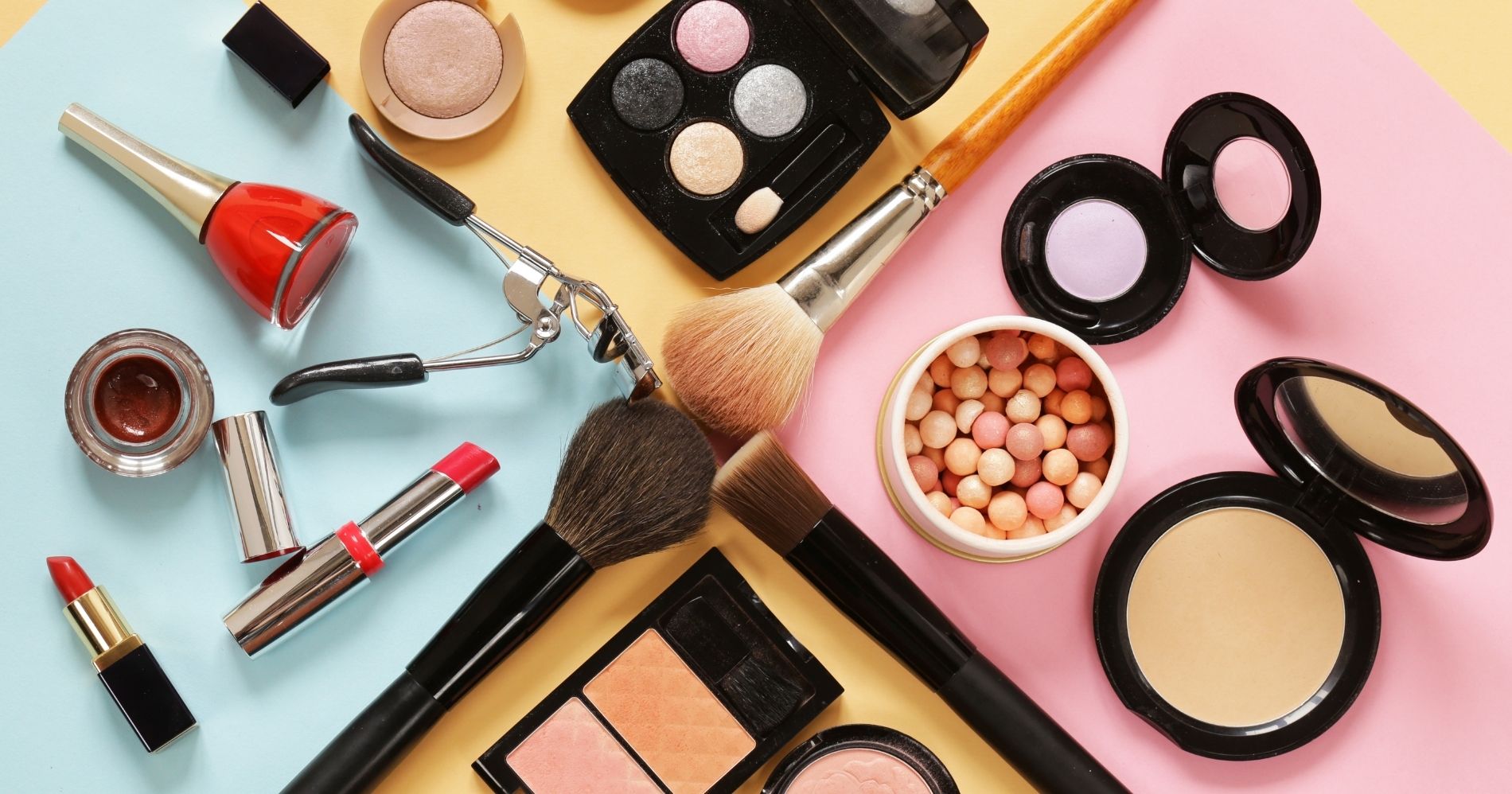 Accounting ledger and beauty business items arranged on a desk